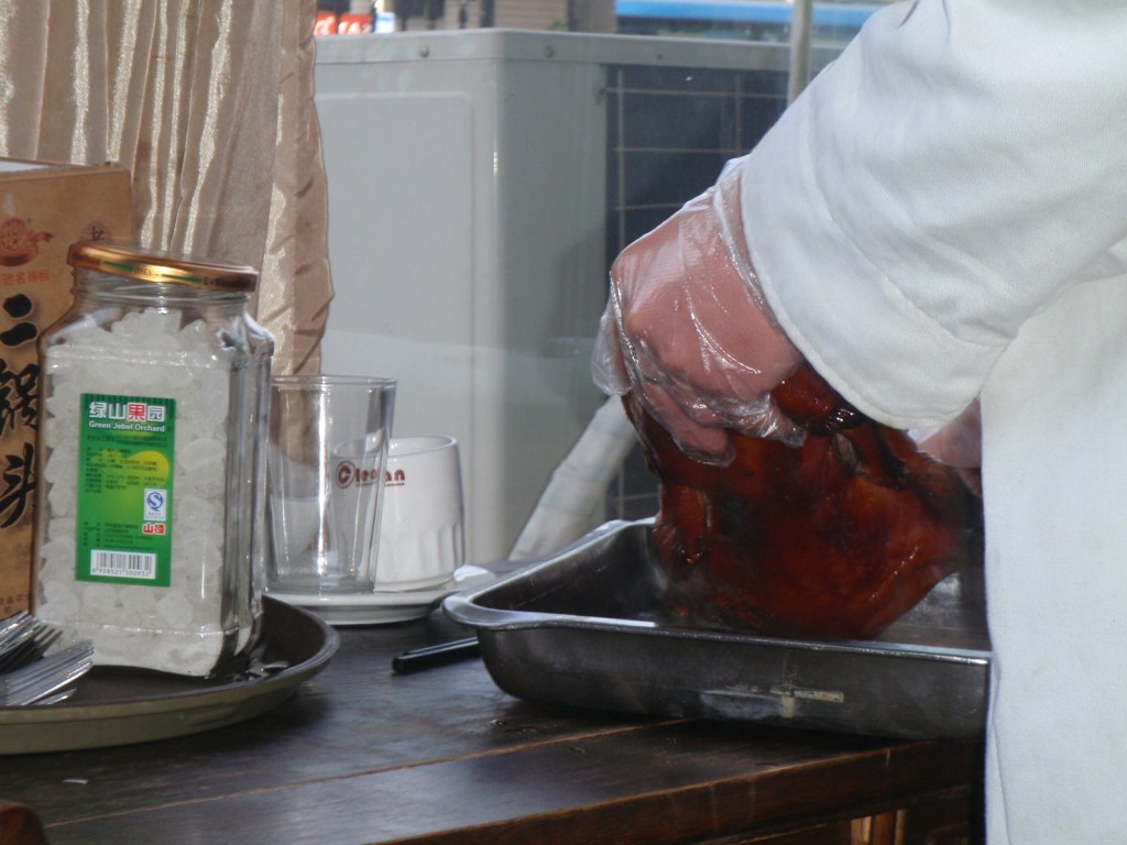 Peking Duck getting carved next to our table